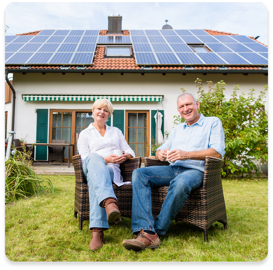 man and woman sitting in front of solar roof