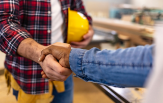 Contractor shaking hands with homeowner