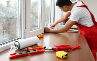 contractor sealing windows in home