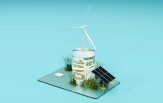 A solar panel, $100 bill, wind turbine, and some patches of grass depicted in miniature size sitting on top of a debit/credit card.